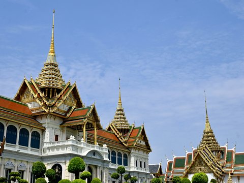 a large white building with a red roof