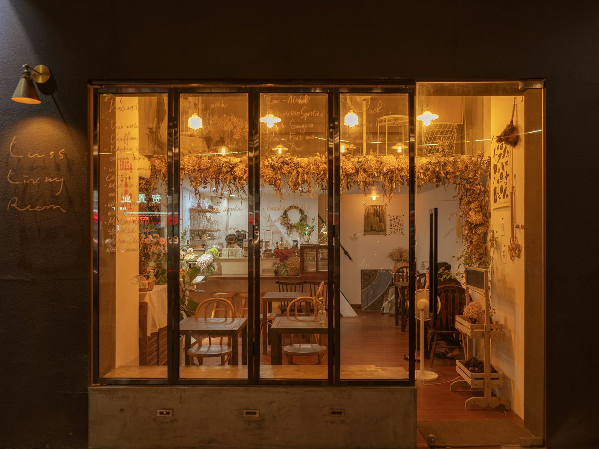 a store front at night with lights on