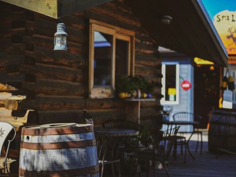 Rustic wooden building with outdoor seating area