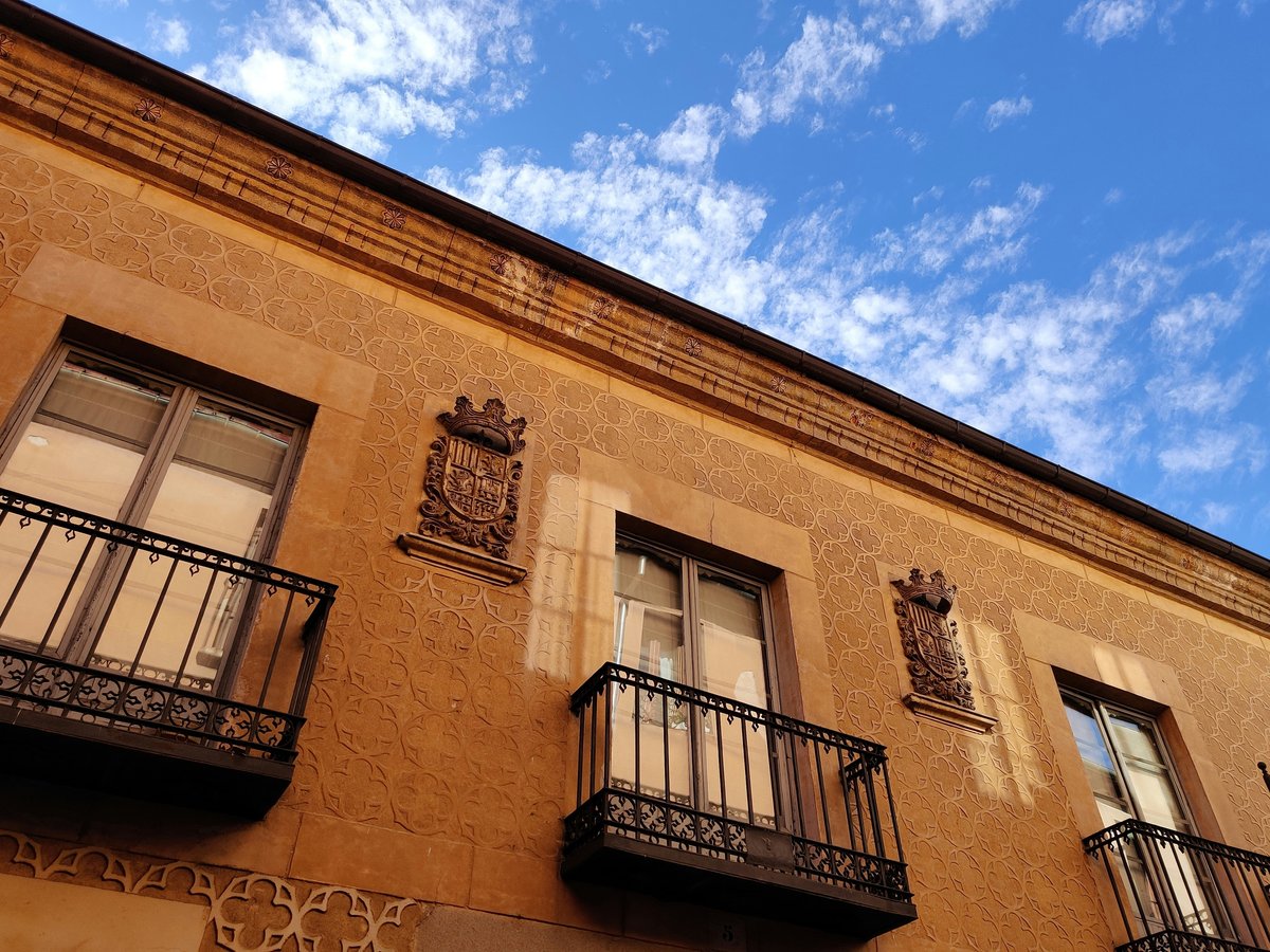 a tall building with balconies and a balcony