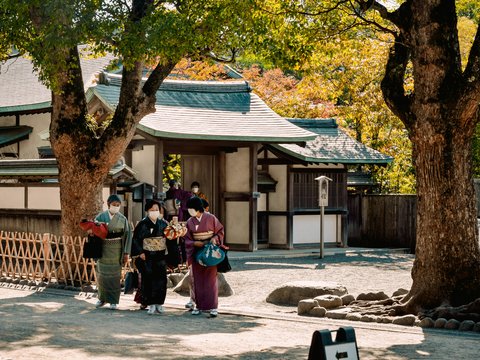 a group of people standing in front of a building