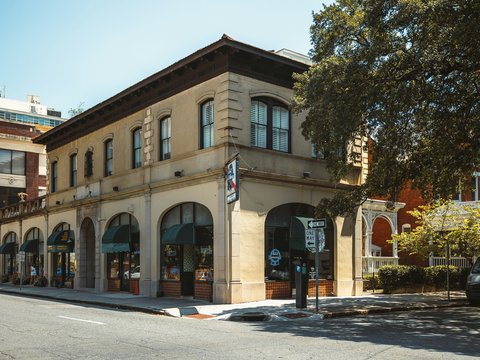 a street corner with a building on the corner