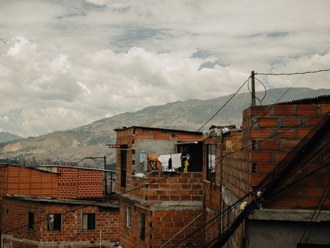 a brick building with clothes hanging out of the window