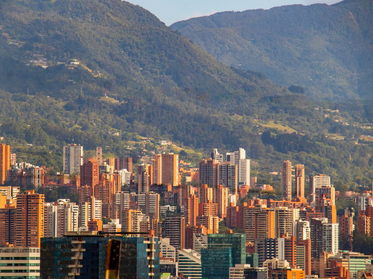a view of a city with mountains in the background