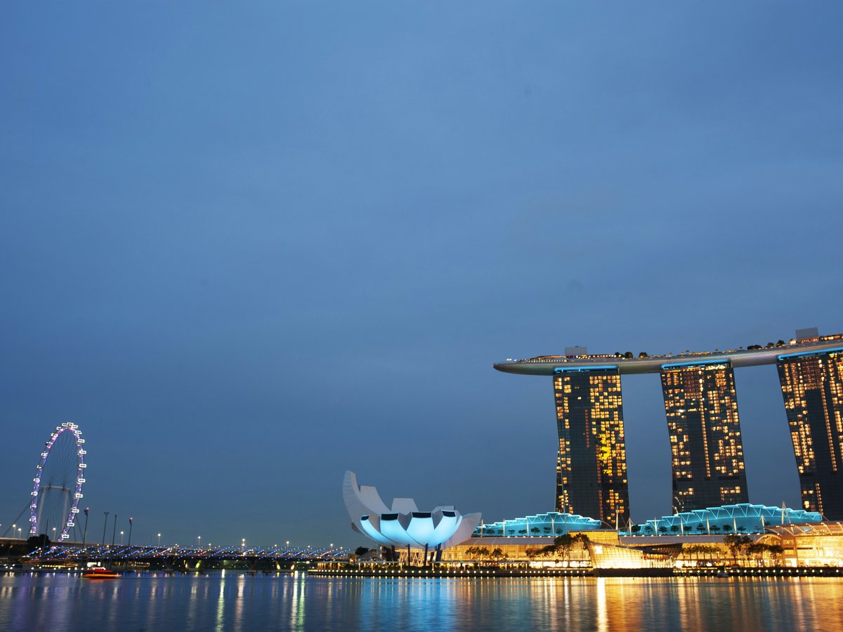 a large body of water next to tall buildings