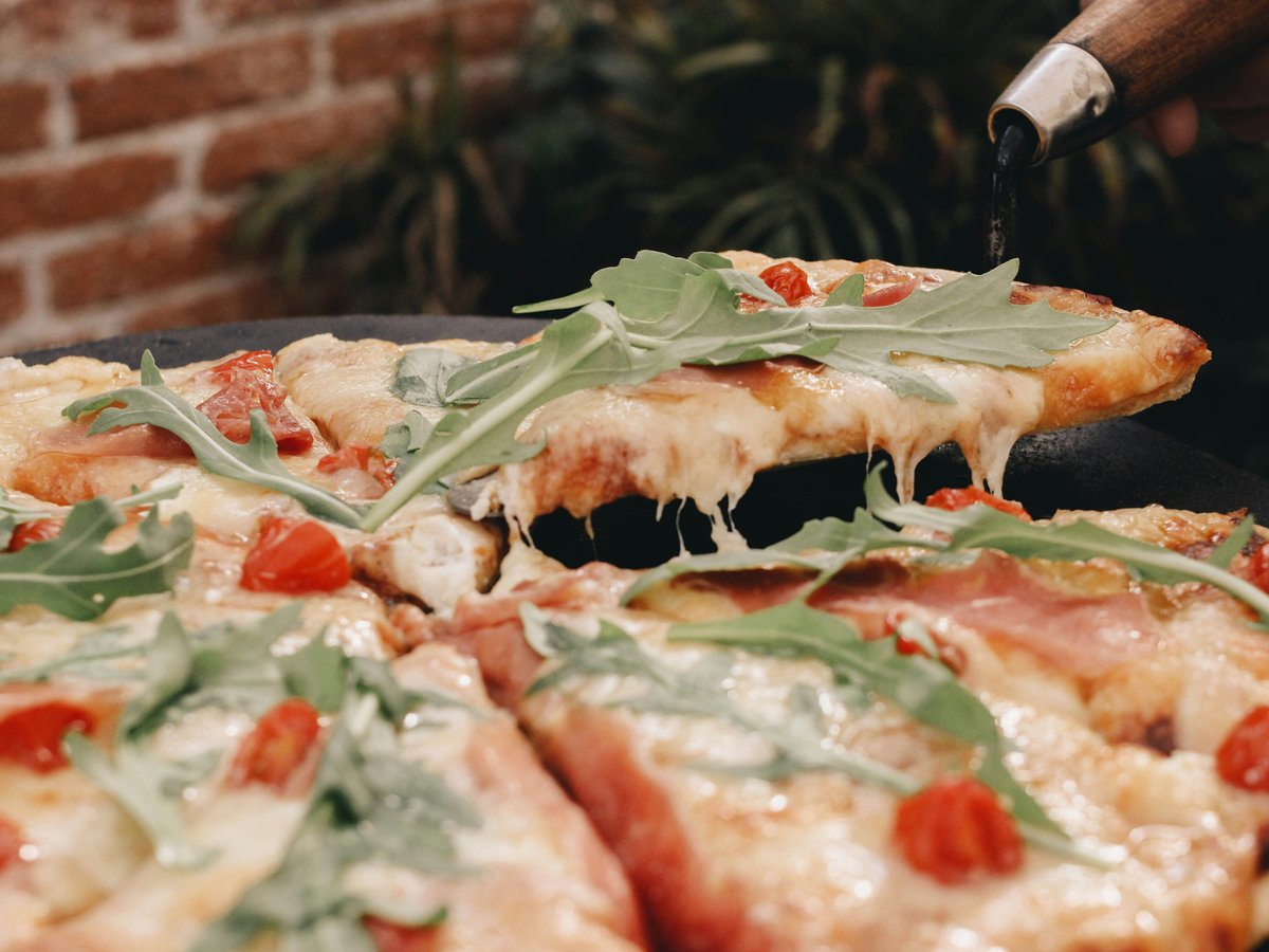 a close up of a pizza on a pan