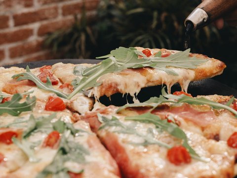 a close up of a pizza on a pan