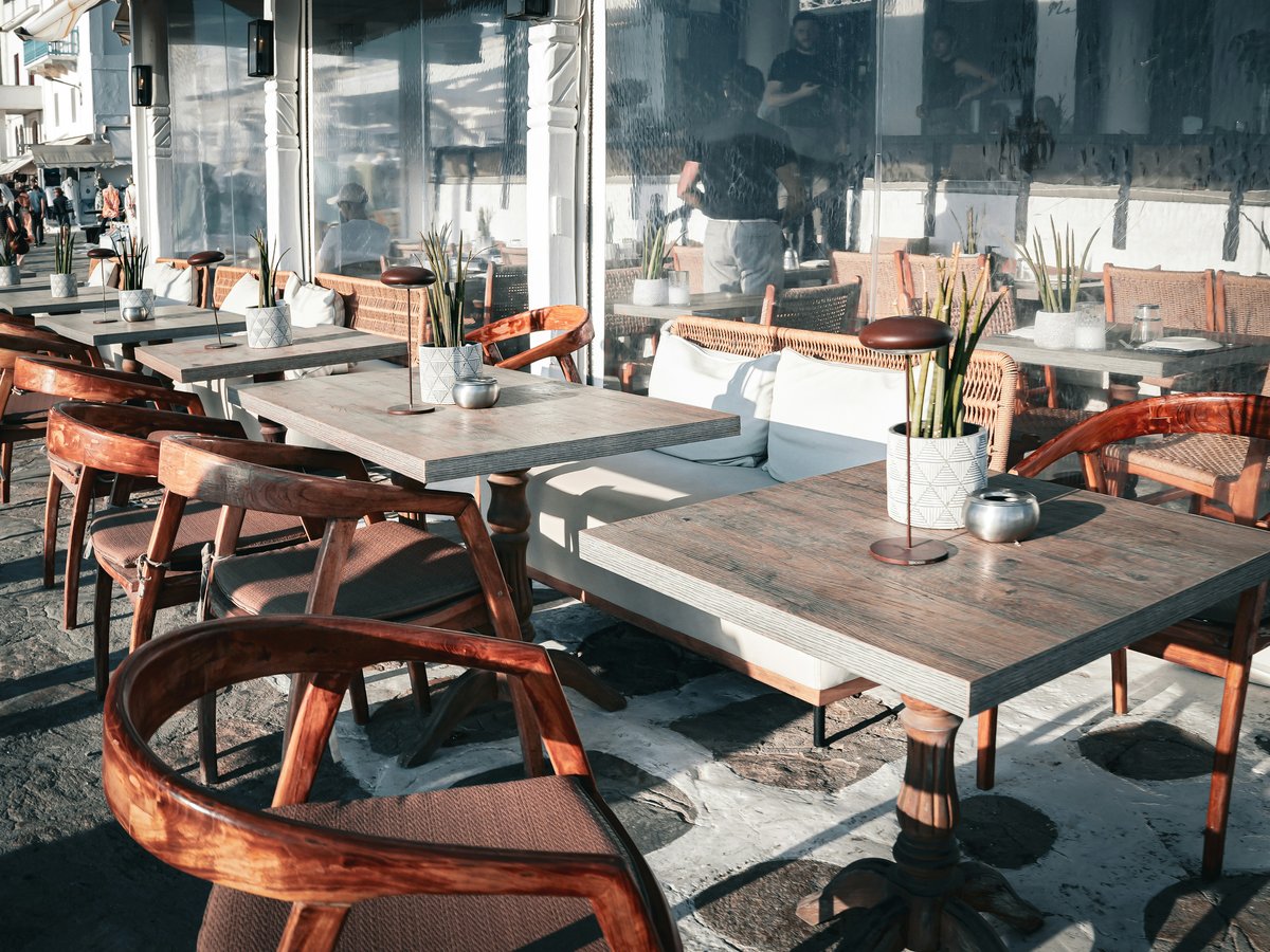 An outdoor dining area with tables and chairs
