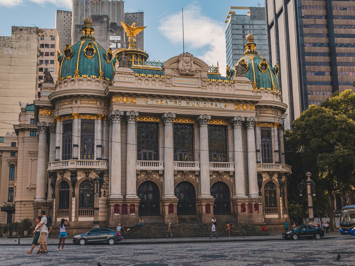 a large building with a gold and blue roof