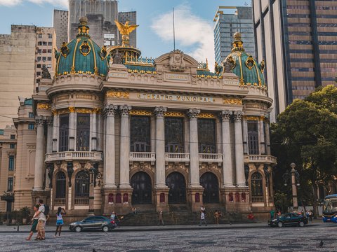 a large building with a gold and blue roof