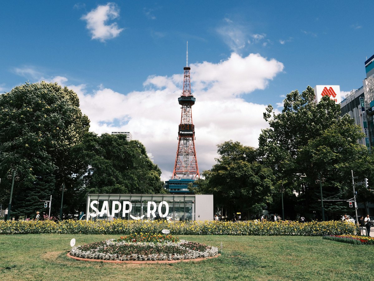 Sapporo TV tower surrounded by trees and buildings