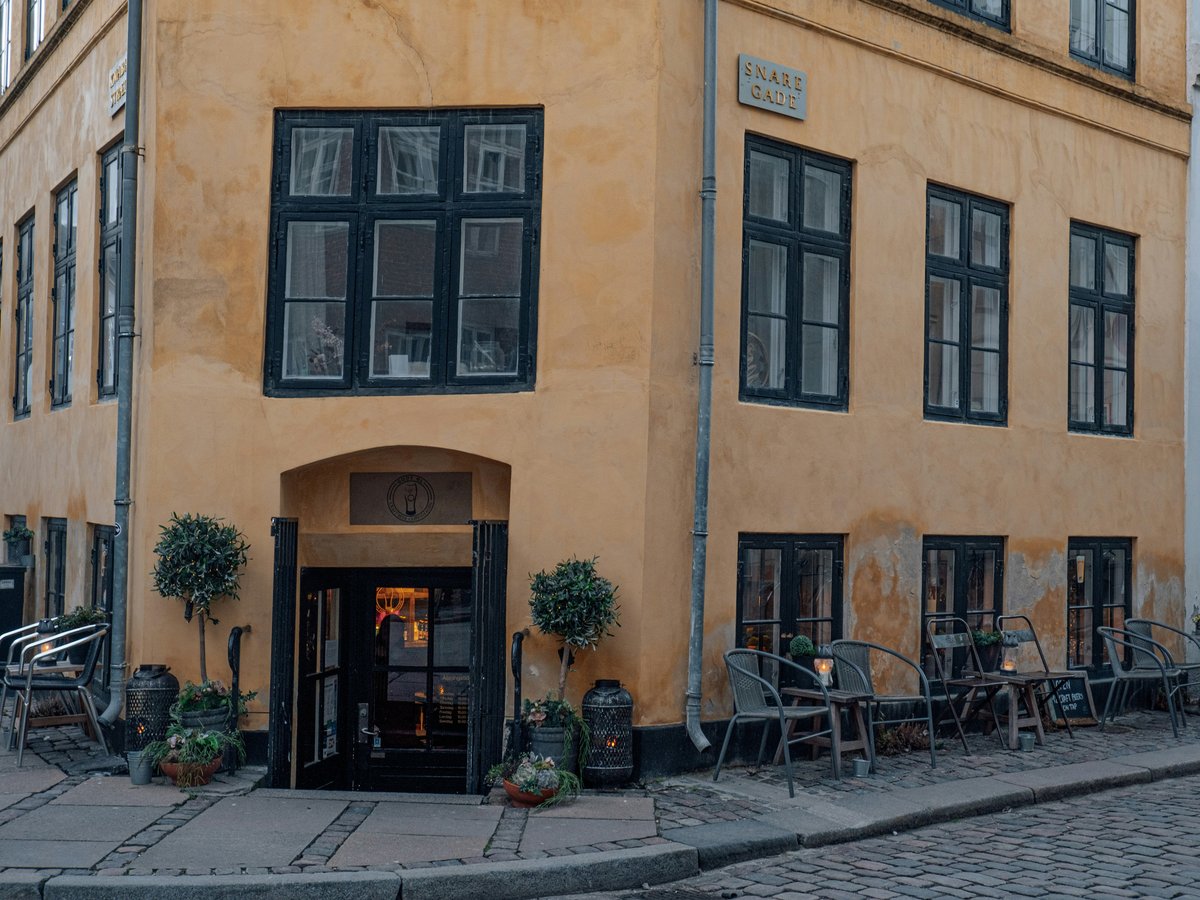 a building with tables and chairs outside