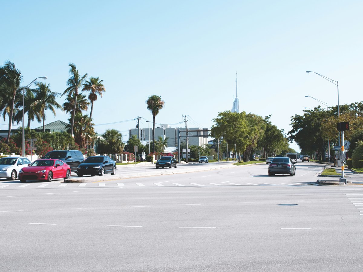 assorted-brand vehicles on the road during daytime