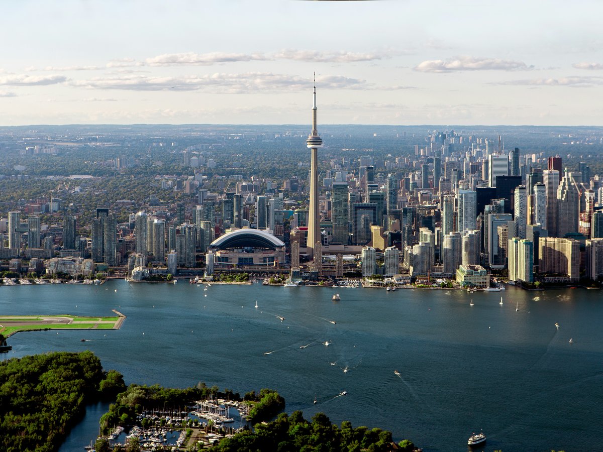 gray buildings near body of water in aerial photo