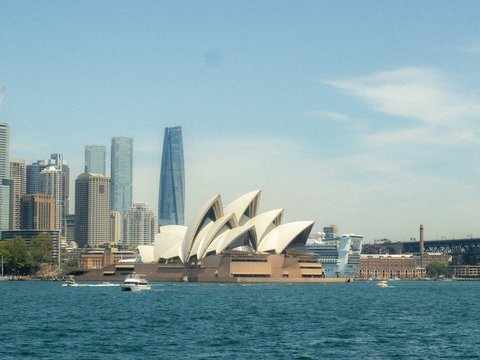 Sydney opera house and city skyline across water