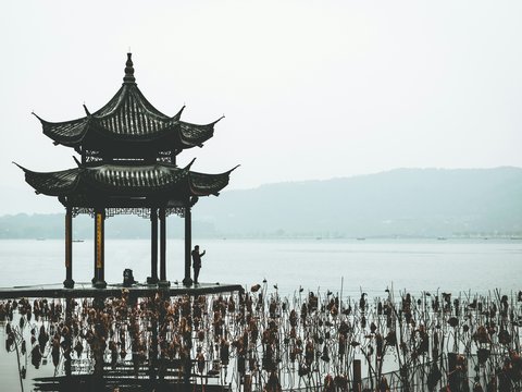 brown wooden gazebo on beach during daytime
