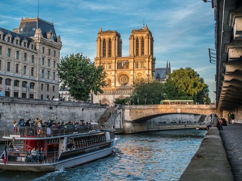 a boat on a river with buildings on either side of it