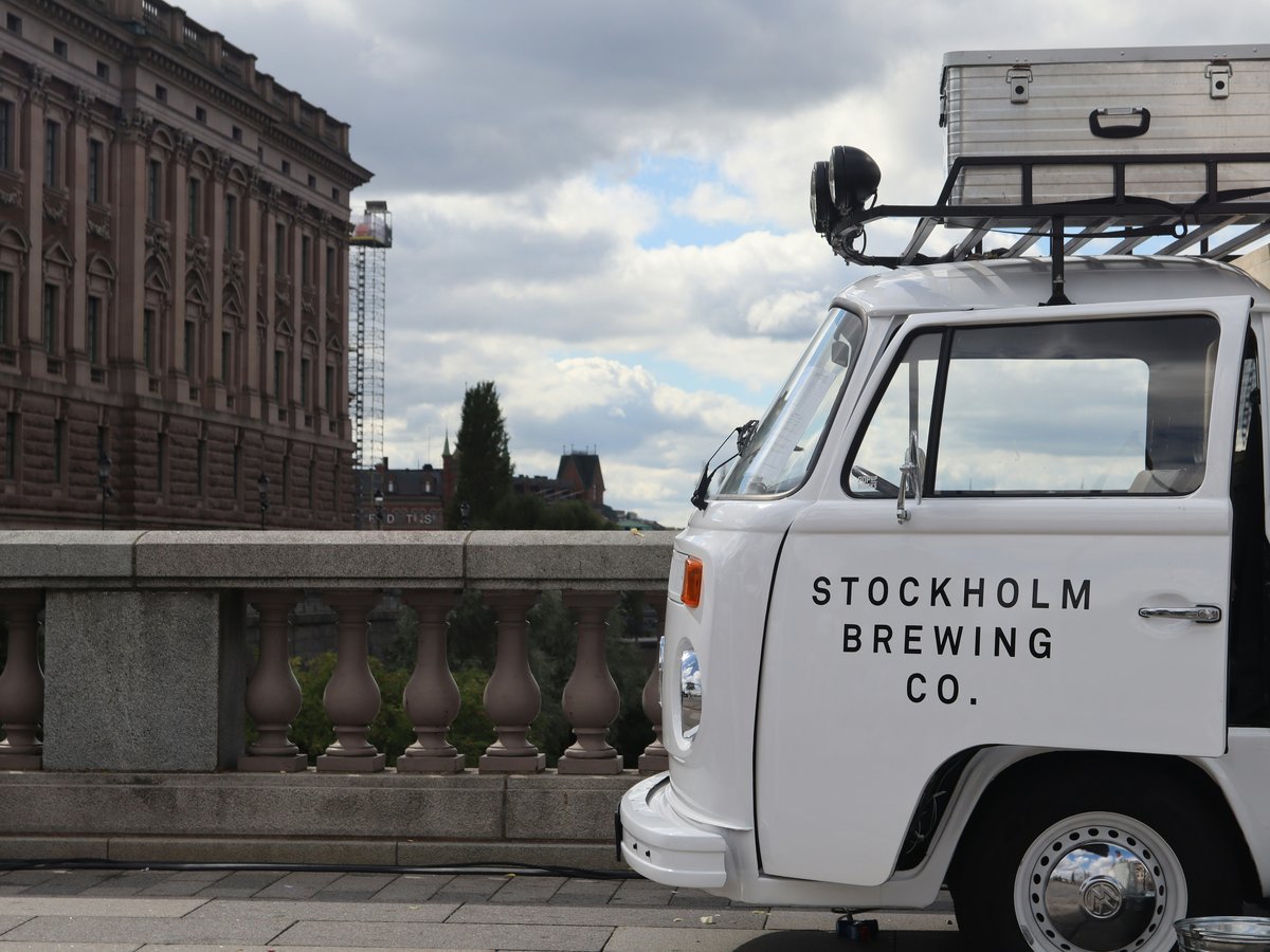A small white truck parked on the side of a road