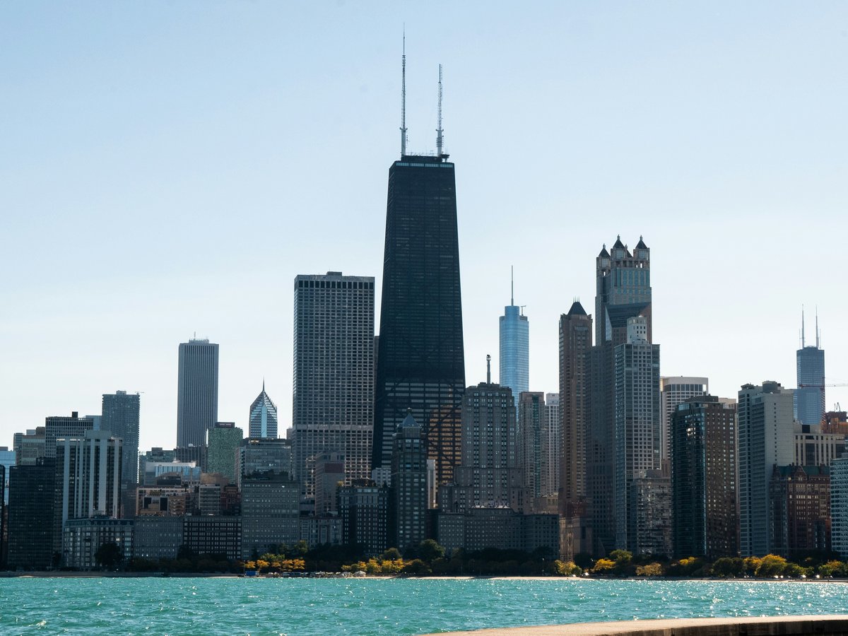 high rise buildings near body of water during daytime