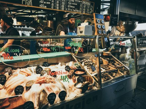 man selling assorted foods