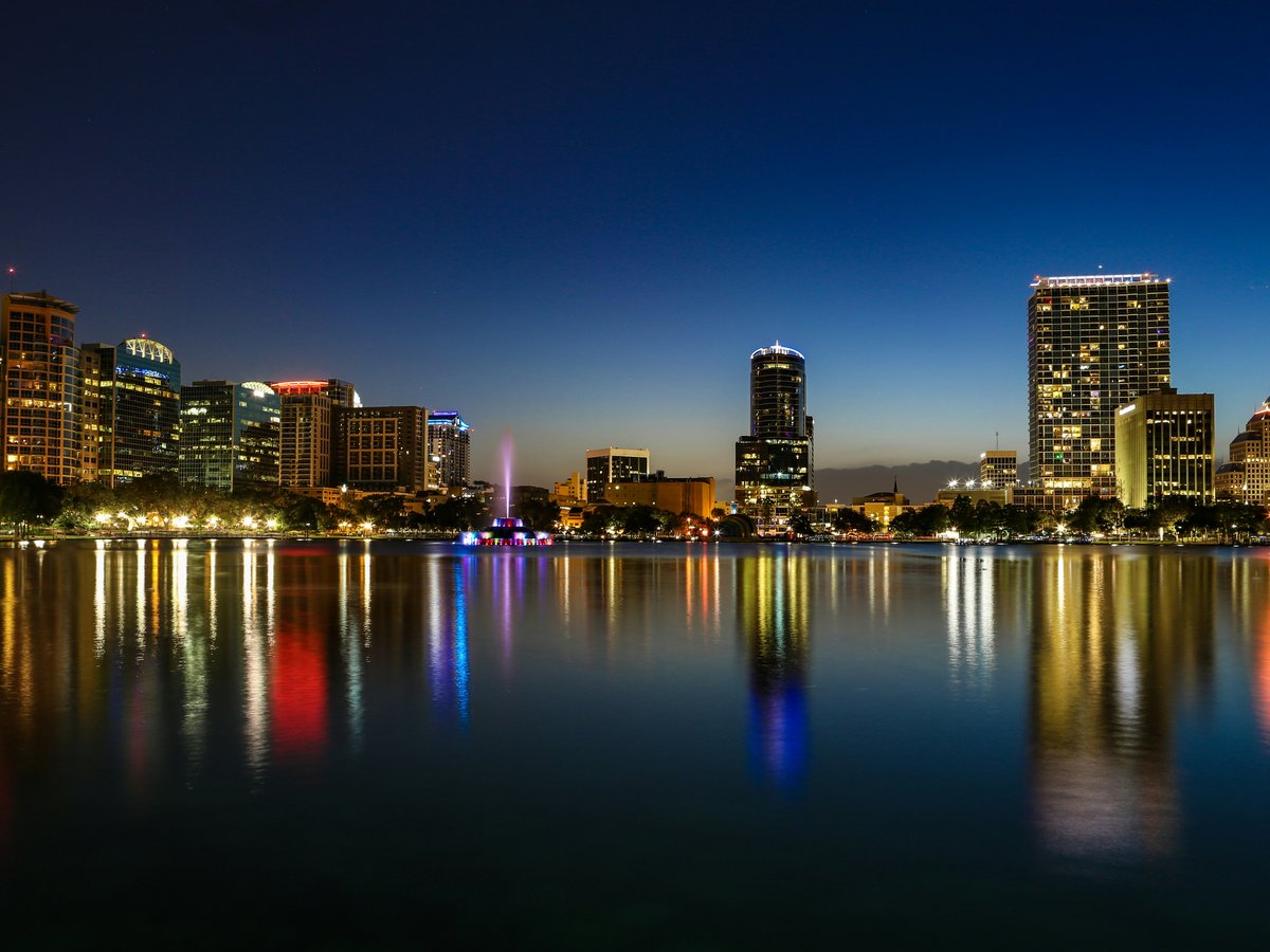 a view of a city at night from across a lake