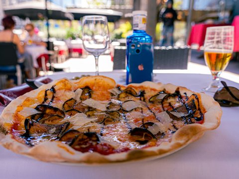 a pizza sitting on top of a white table