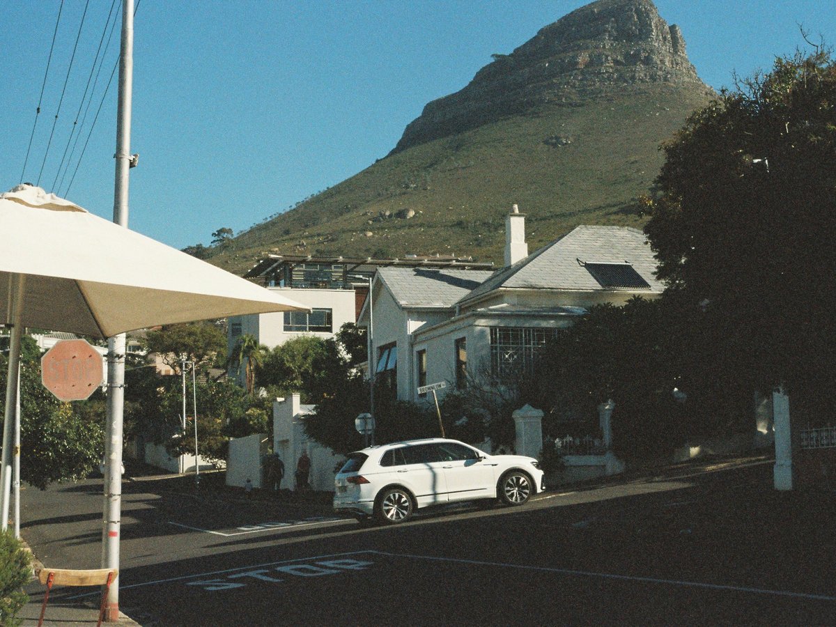a white car parked on the side of a road