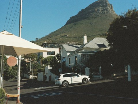 a white car parked on the side of a road