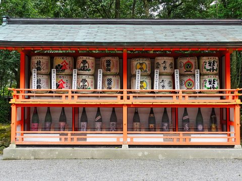 a small shrine with a lot of bottles on it