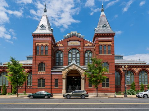 A large red brick building with two towers