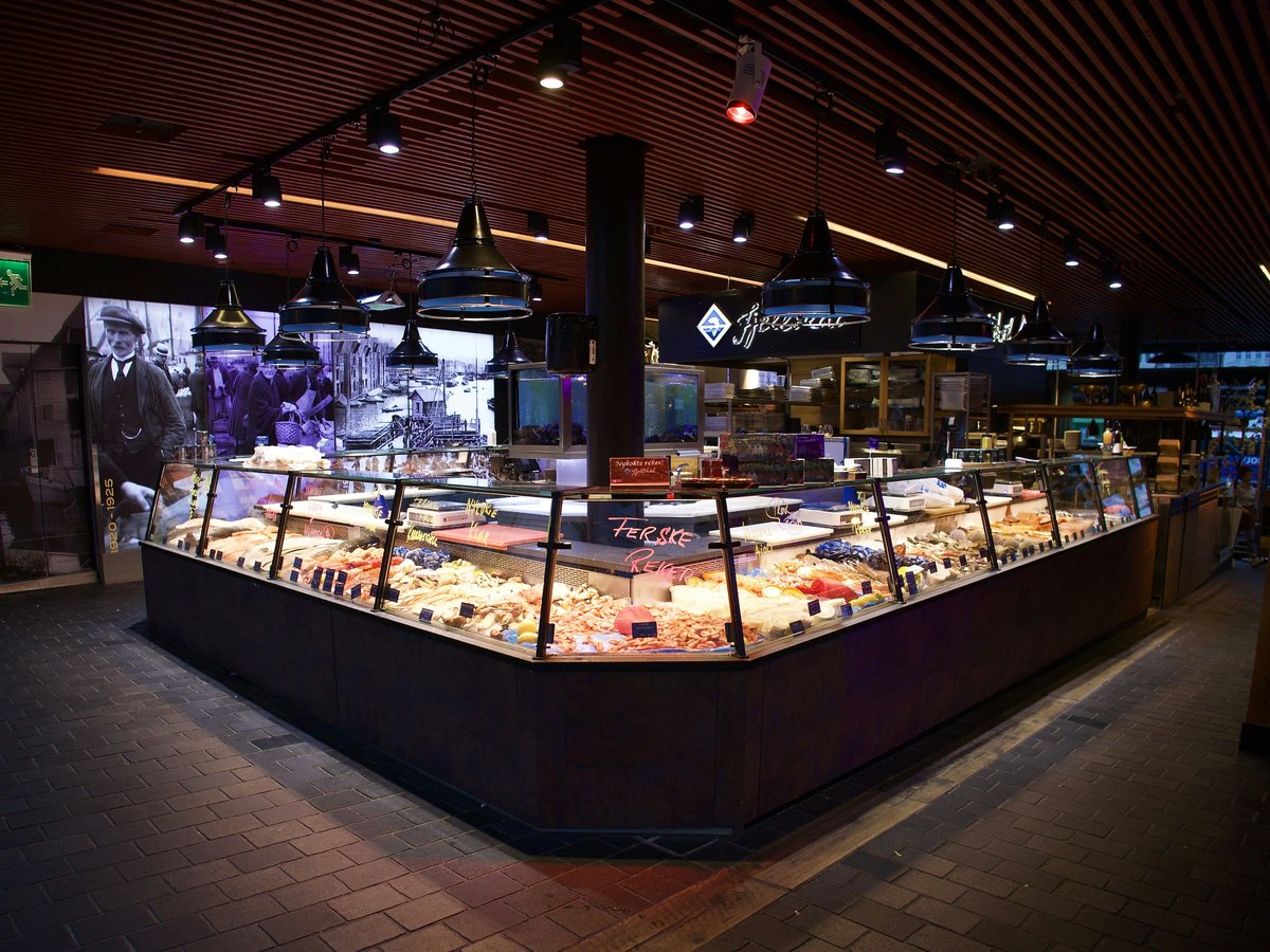 a large display case in a restaurant filled with lots of food