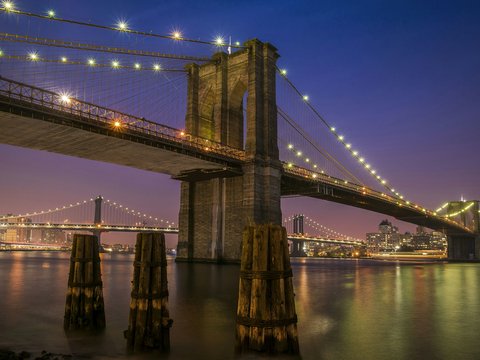 Brooklyn bridge with lights at night time