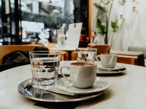 white ceramic teacup on saucer
