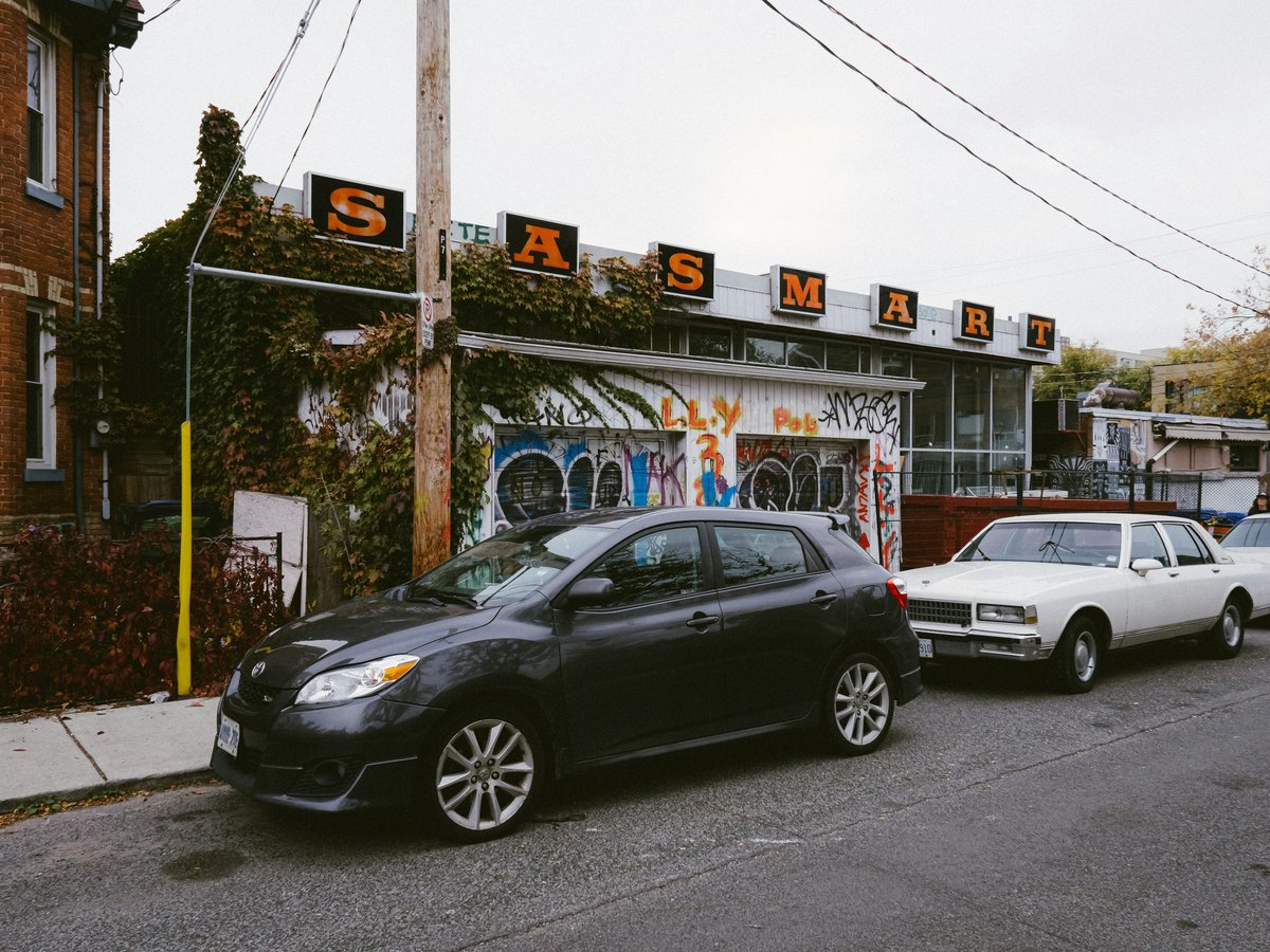Several cars parked on the side of the road