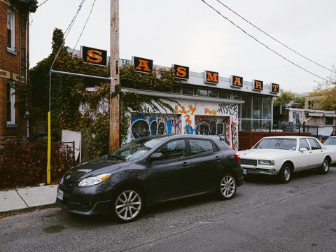 Several cars parked on the side of the road