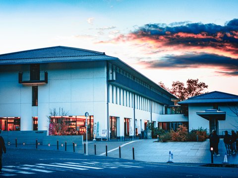 A large white building with a cross on the top of it