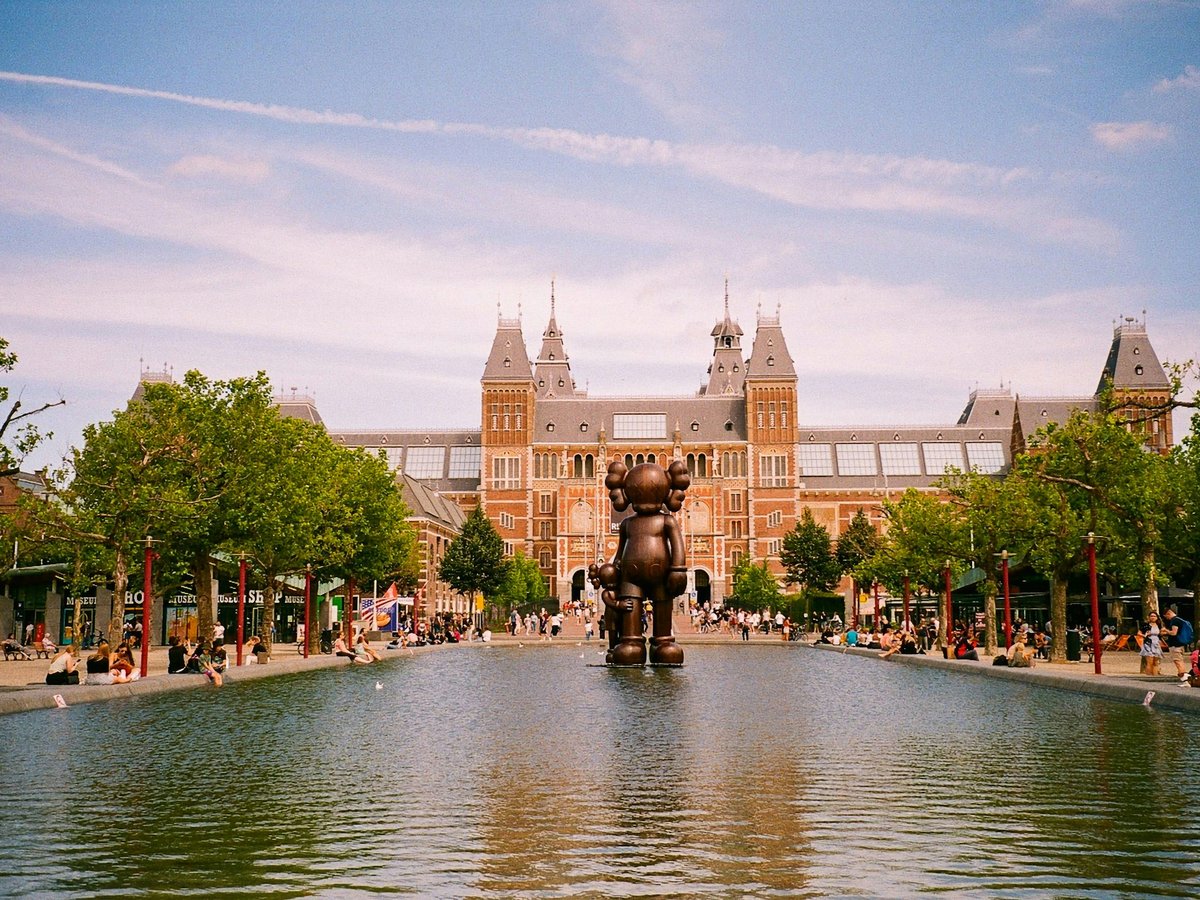 a large building with a fountain in front of it