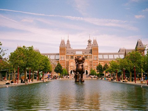 a large building with a fountain in front of it