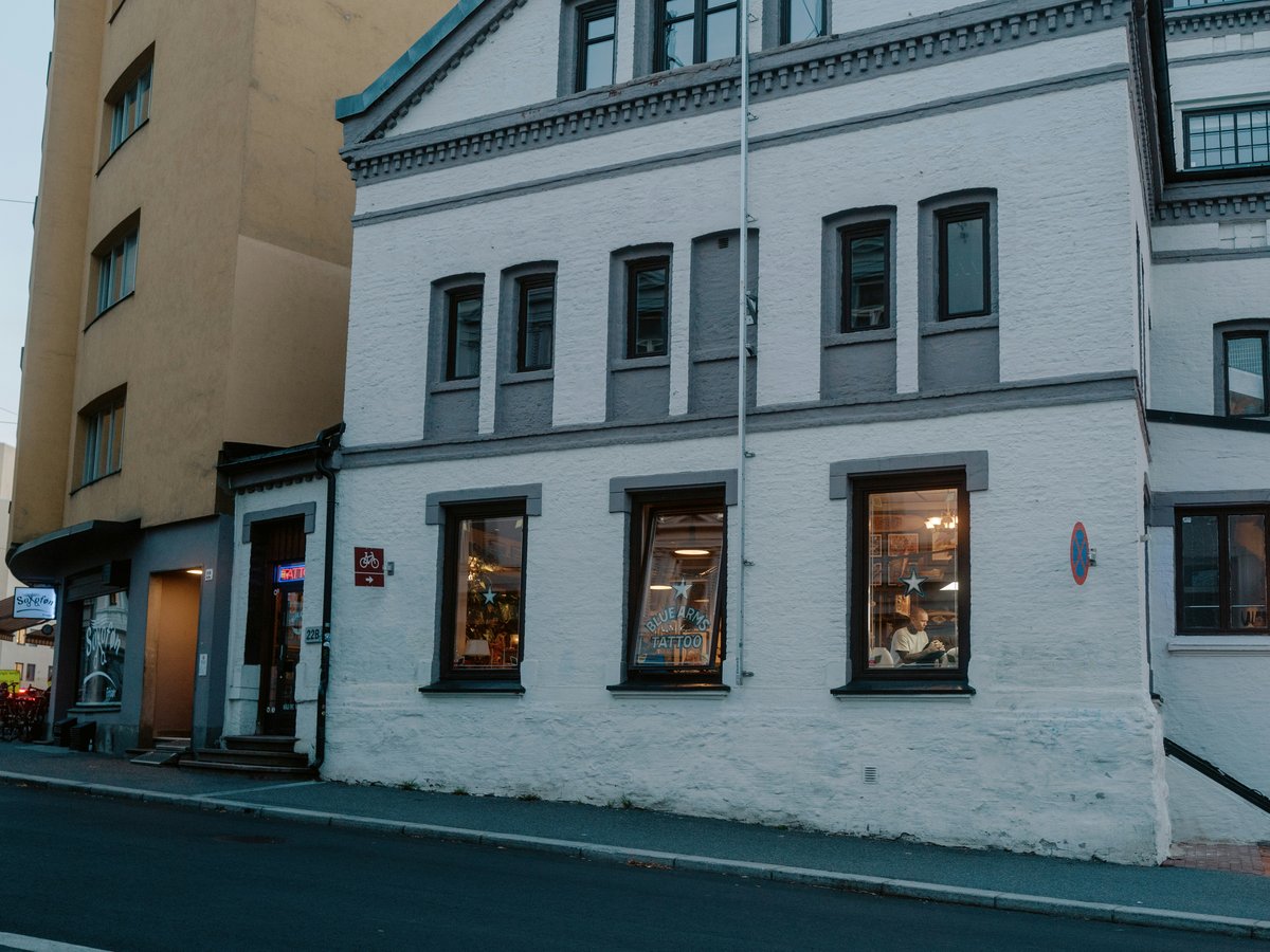 a white building sitting on the side of a road
