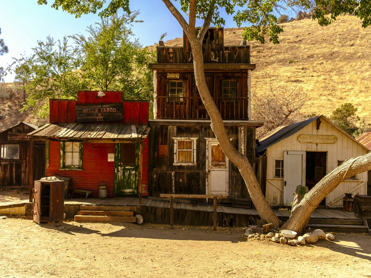 Old west town with weathered buildings.
