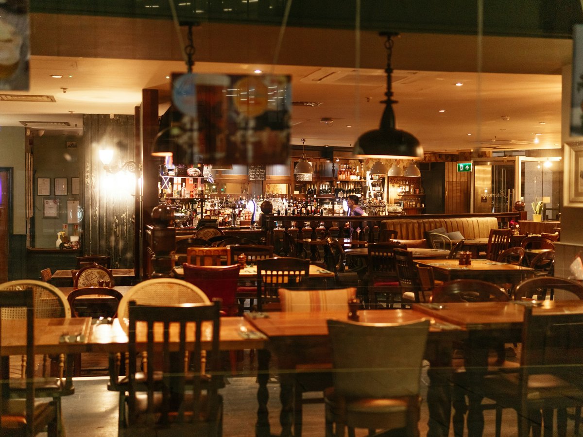 a restaurant with tables and chairs