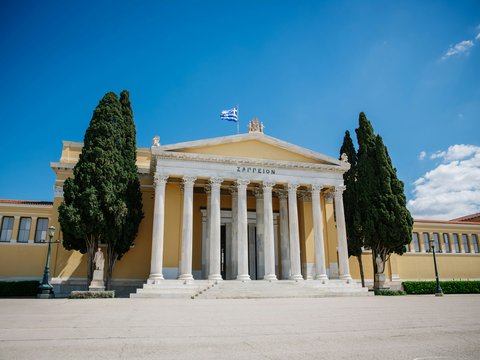 Zappeion hall, a classical building with columns, under blue sky.
