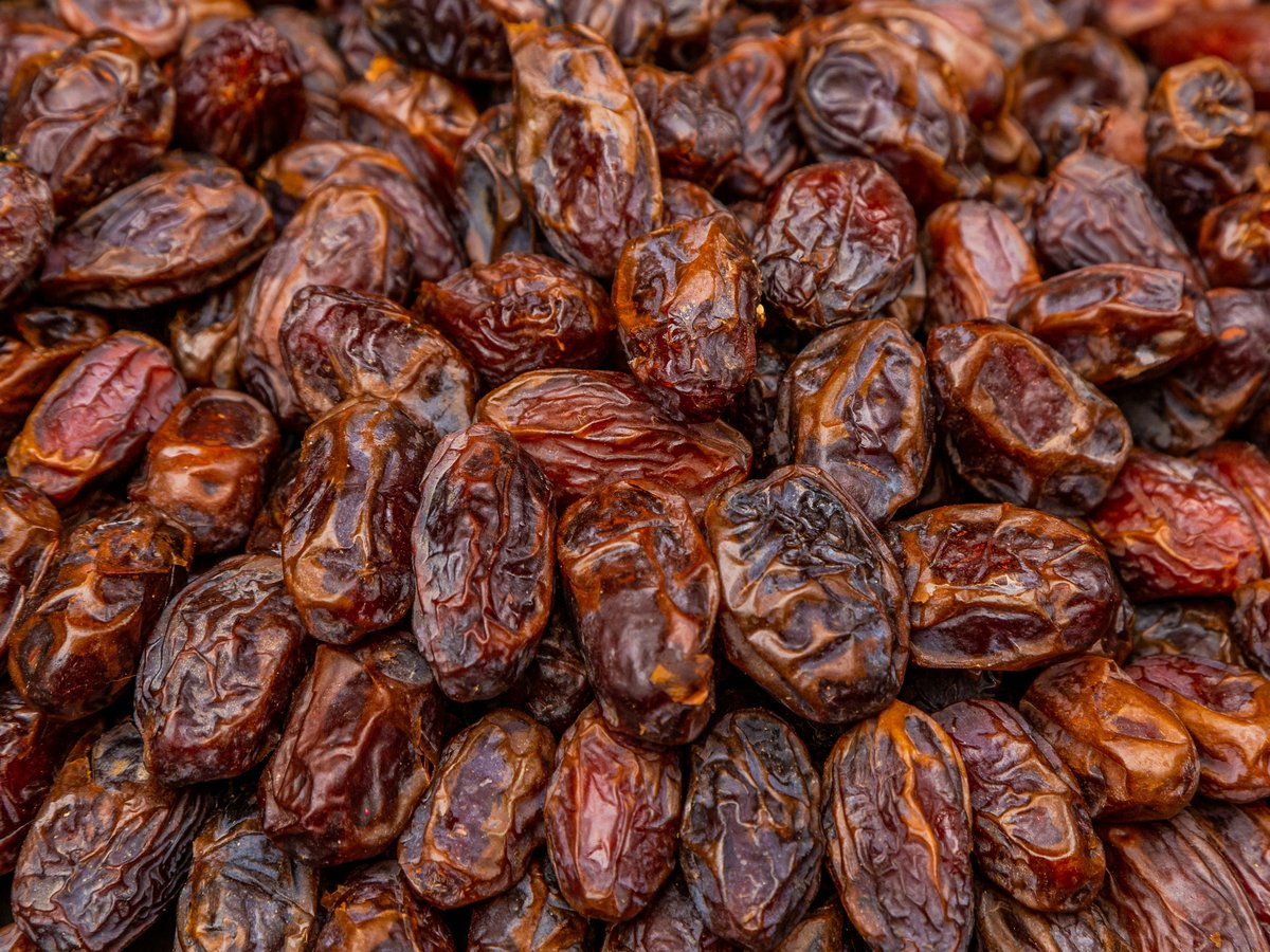 a pile of raisins sitting on top of a table