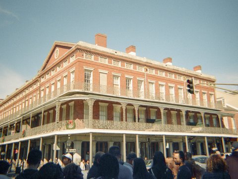 A historic brick building stands in the city