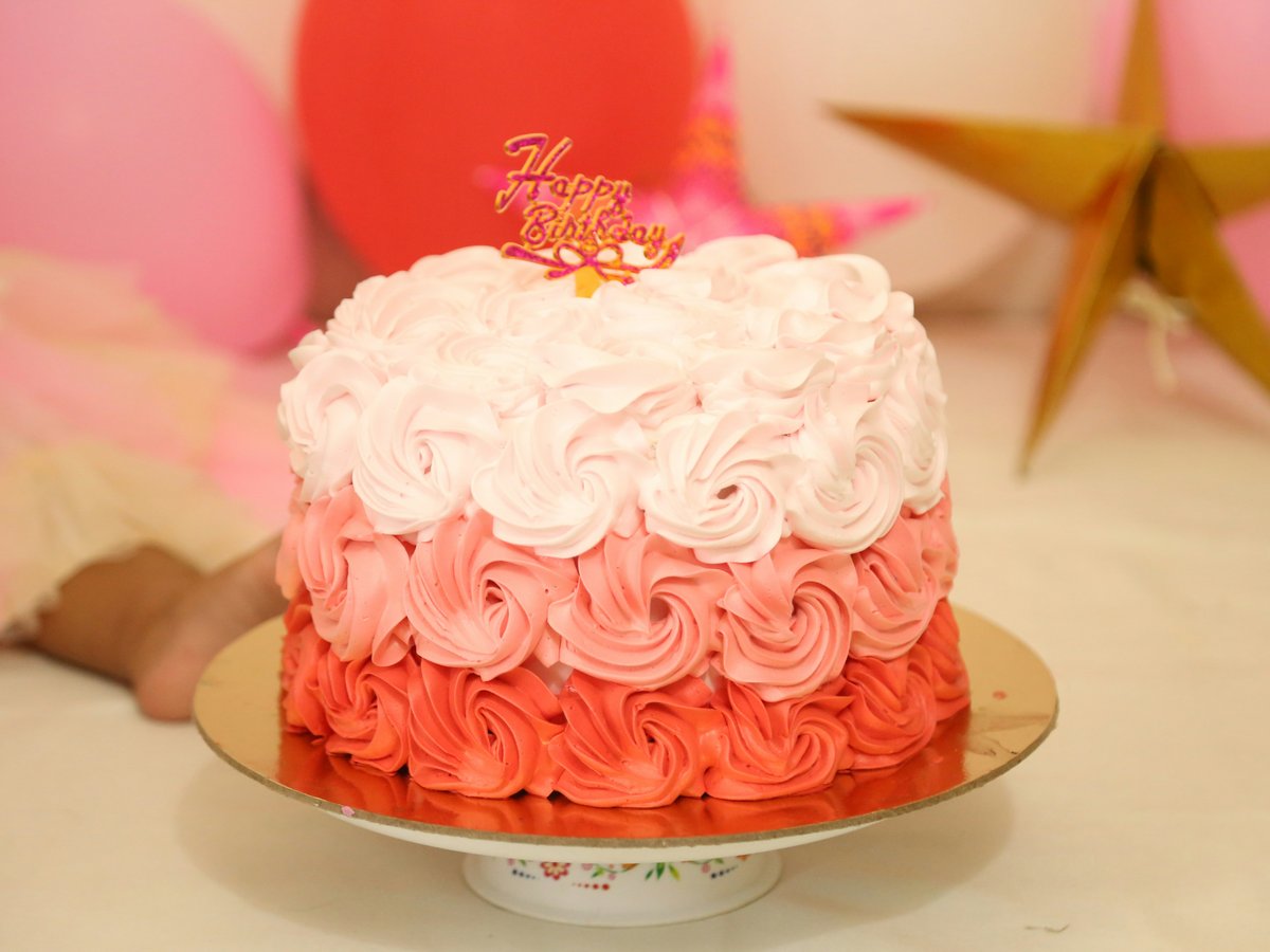 white and pink cake on white ceramic plate