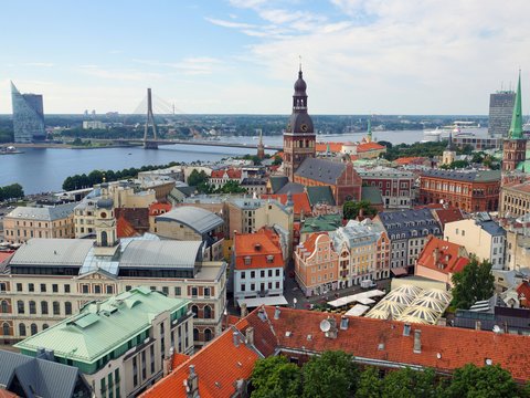 an aerial view of a city with a river in the background