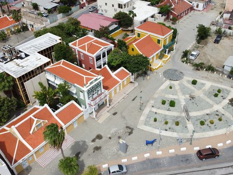 an aerial view of a town with a clock tower