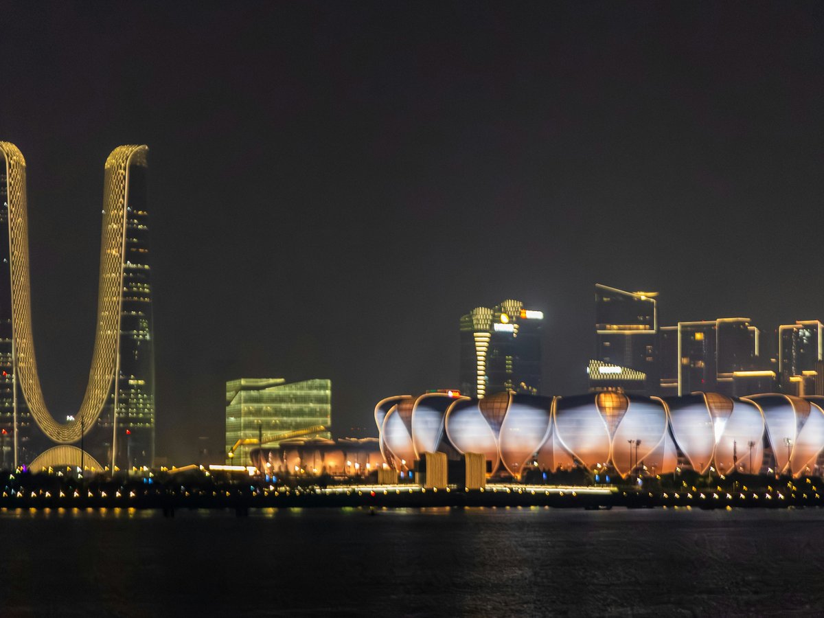 a night view of a city with a lot of tall buildings