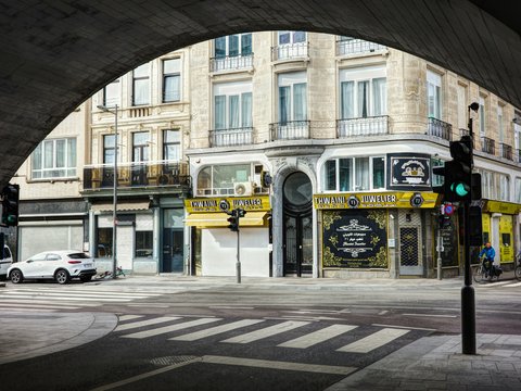 a view of a city street from under a bridge