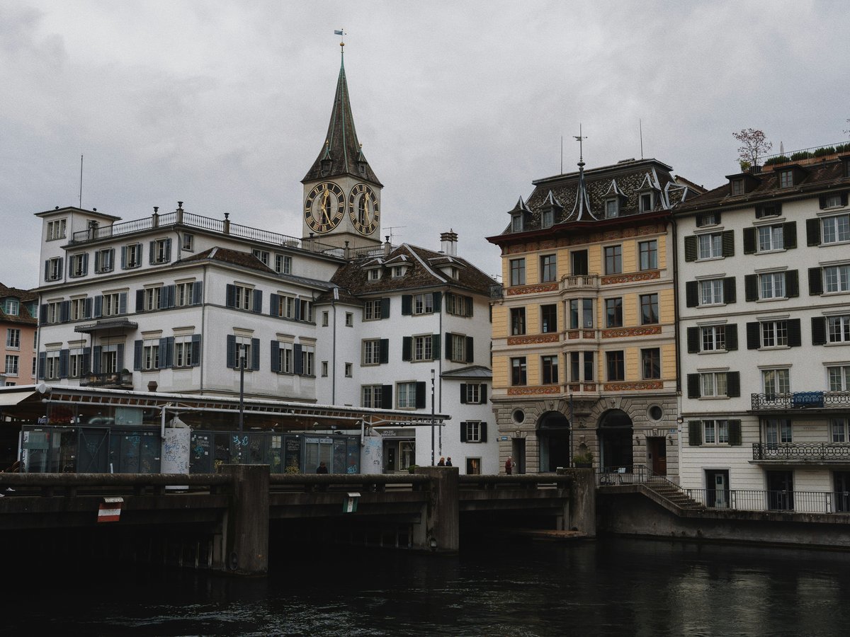 a group of buildings next to a body of water